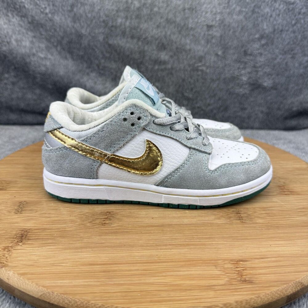 Nike Kids Sneakers in Gray, White, and Gold